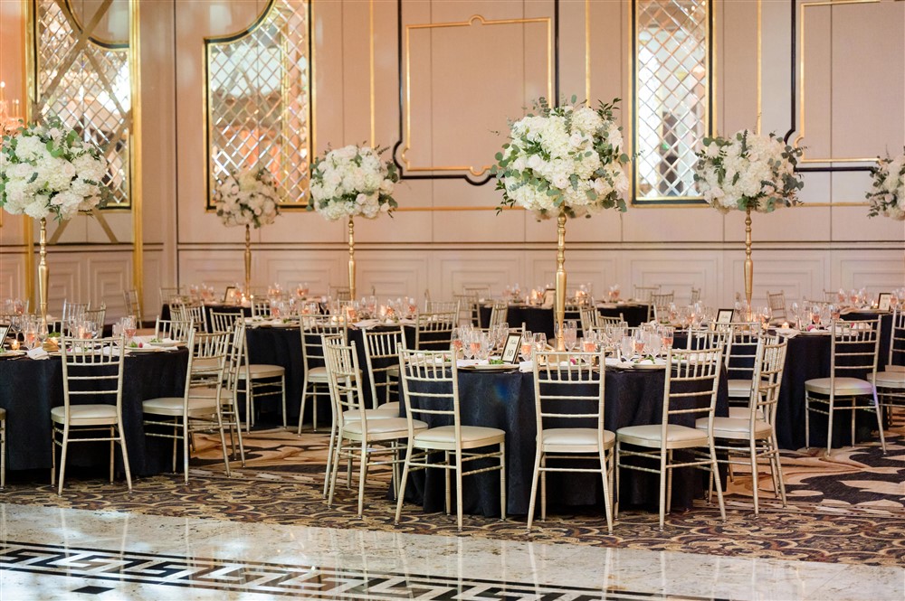 wedding reception at shadowbrook with gold and white flowers centerpieces