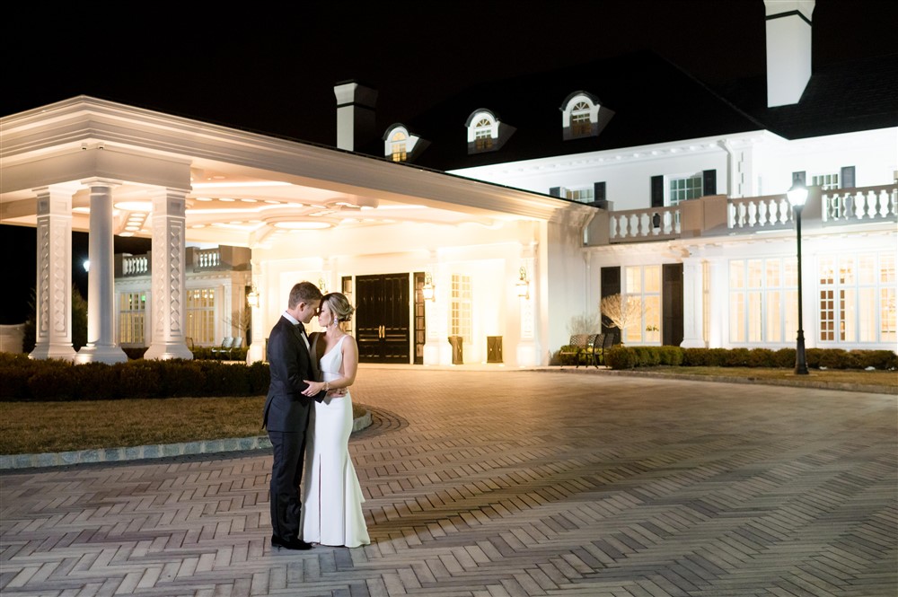 bride and groom in front of shadowbrook venue 