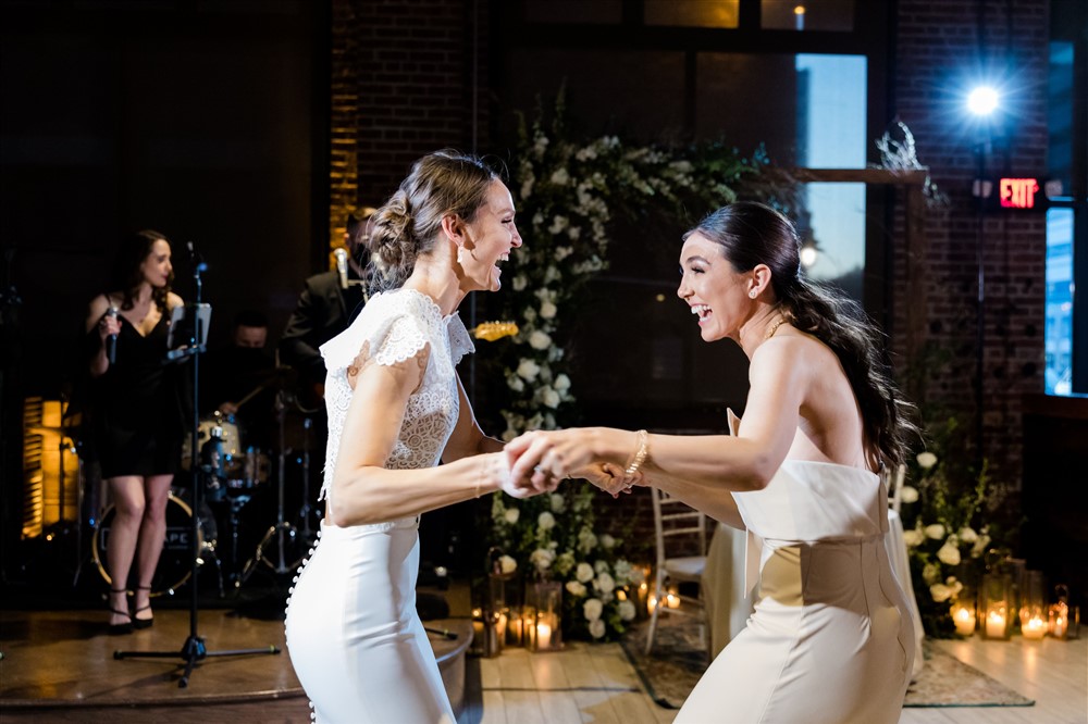 bride and sister dancing 