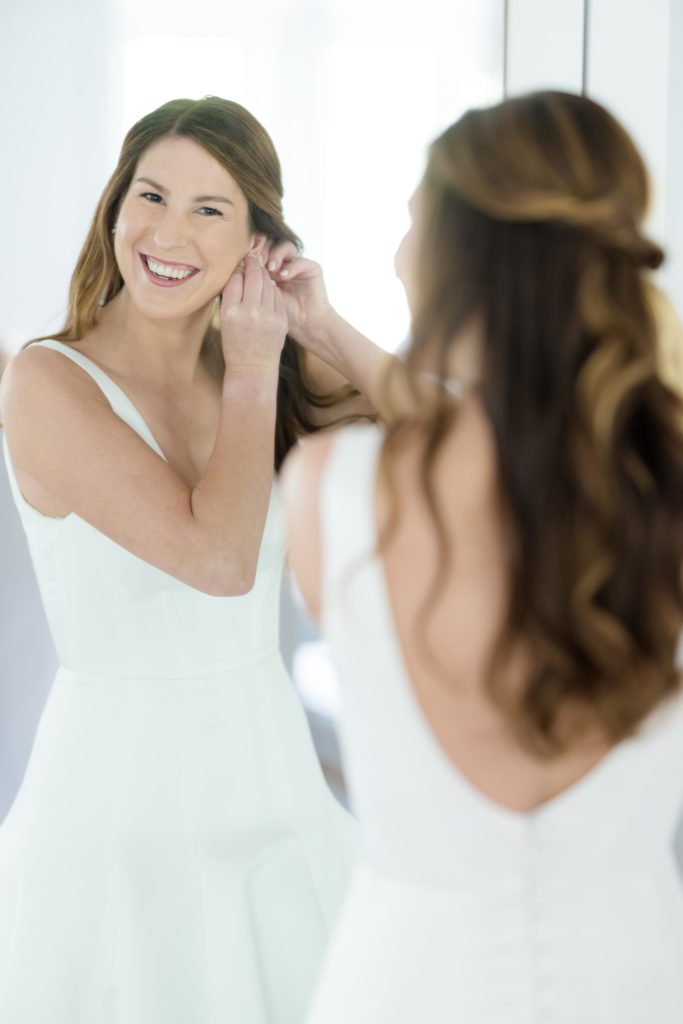 bride looking at mirror