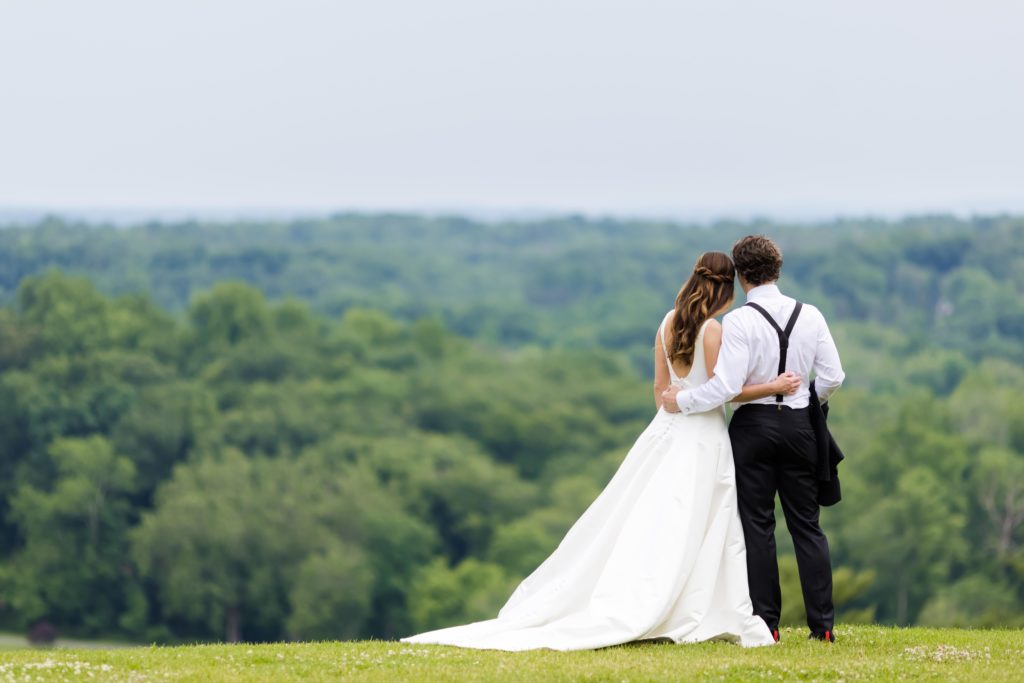 bride and groom looking into horizon