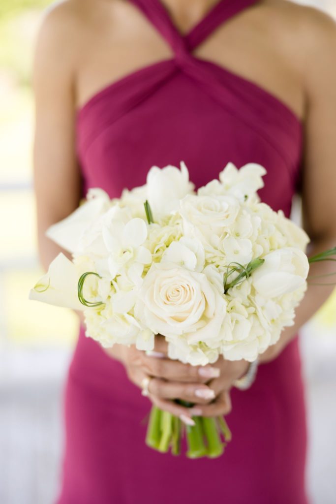 magenta mauve dress holding bouquet