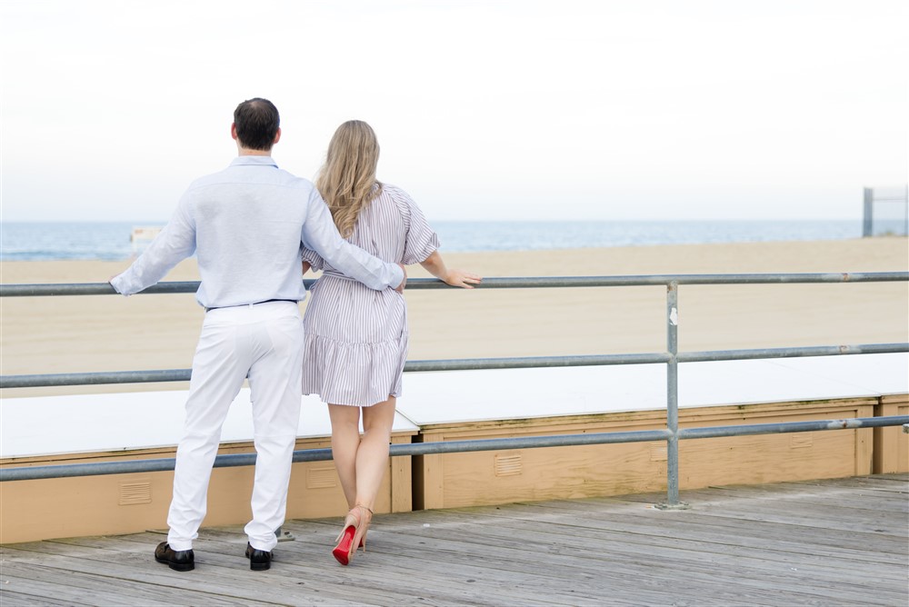 ASBURY PARK ENGAGED COUPLE BY BOARDWALK IN CHRISTIAN LOUBOUTIN