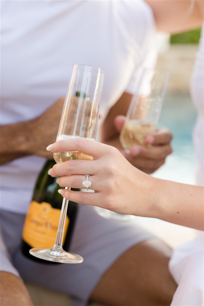 COUPLE POURING CHAMPAGNE